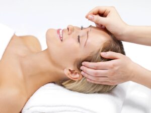 Is Acupuncture Safe? Smiling lady receives needle